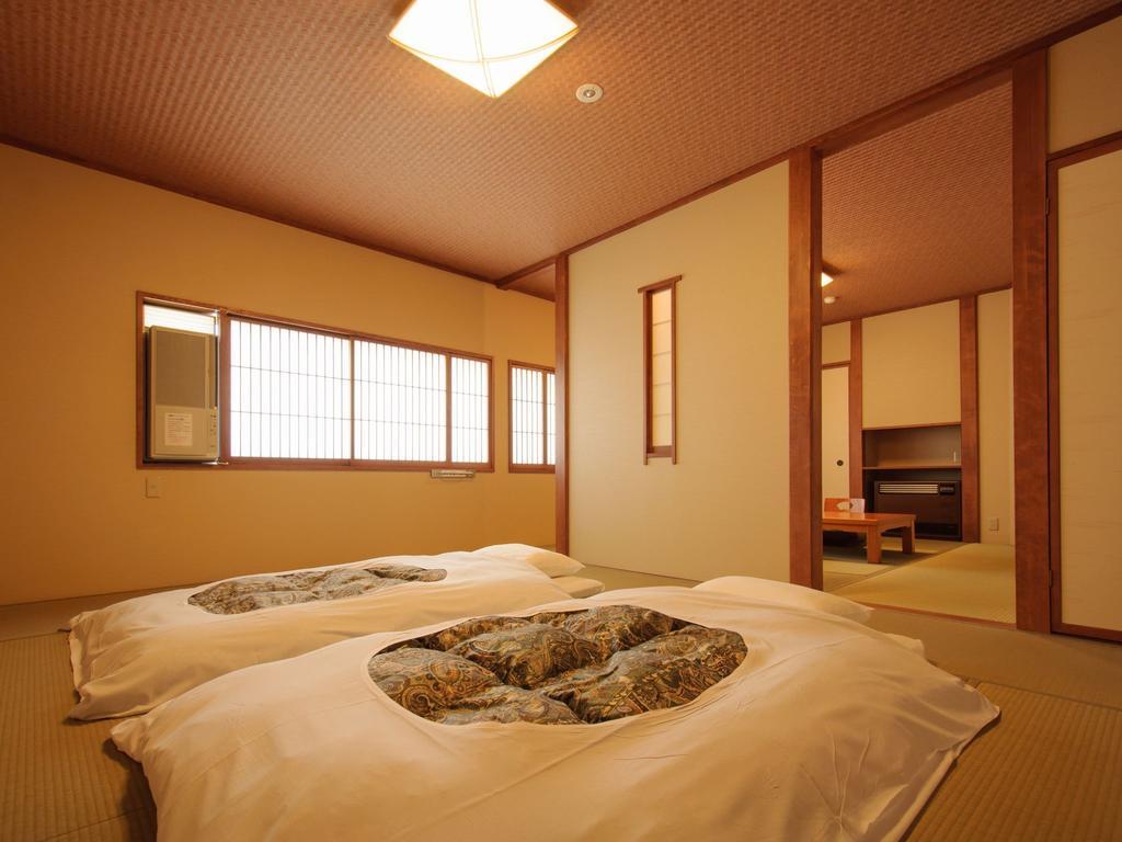 Kusatsu Onsen Ryokan Yoshinoya Hotel Стая снимка